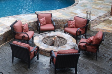 outdoor firepit next to freeform swimming pool