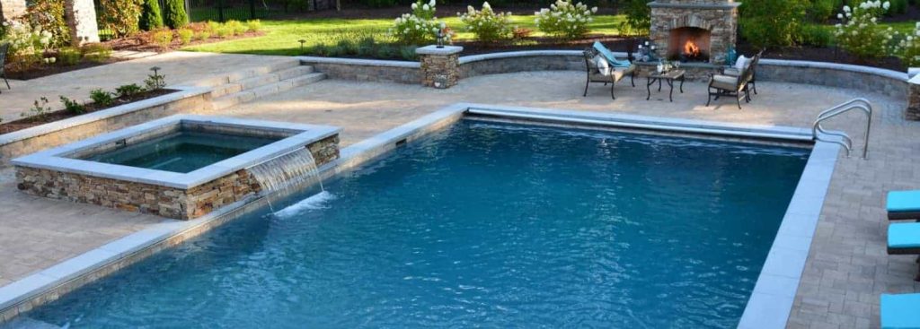 Rectangular inground pool with water feature Douglas Aquatics